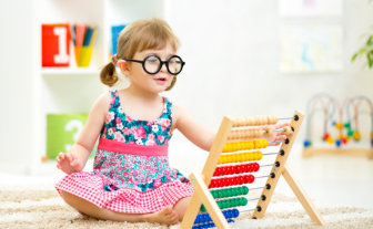 little girl playing abacus